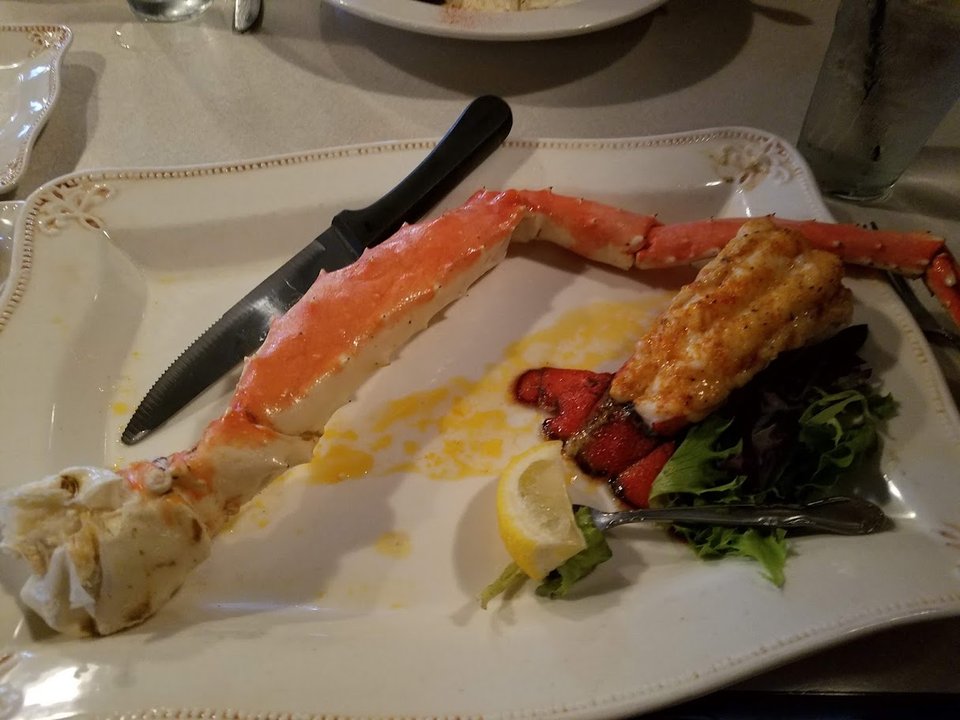 Tables set inside a casual seafood restaurant.
