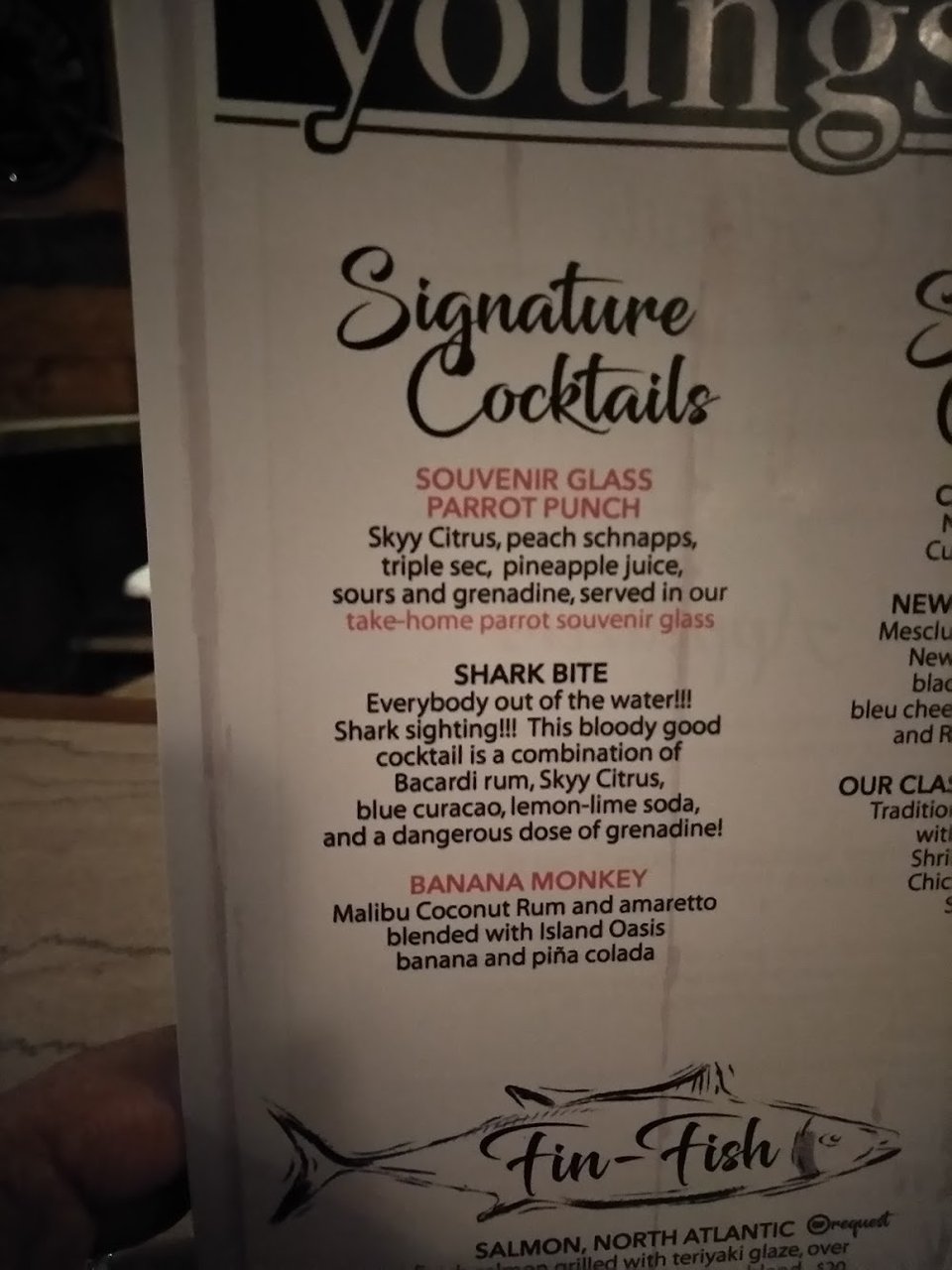 Printed menu featuring shrimp, oysters, and calamari.